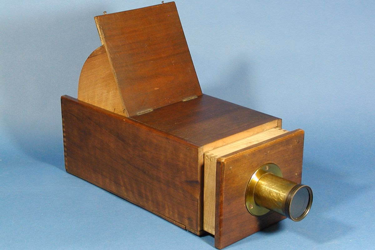 What is the difference between a pinhole camera and a camera obscura?